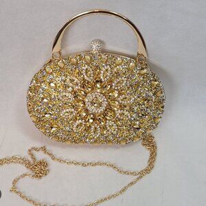 RAMLA Gold oval clutch with handle and chain MSRP $290